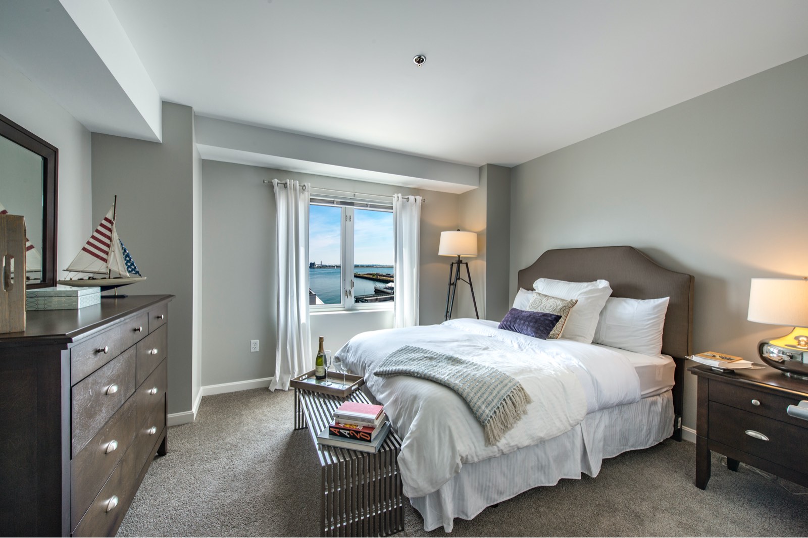 A comfortable bedroom with water views